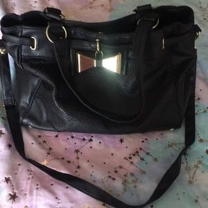Black purse gold hardware from Claire’s